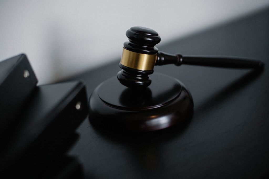 pexels-photo-5668473 Close-up Photo of Wooden Gavel